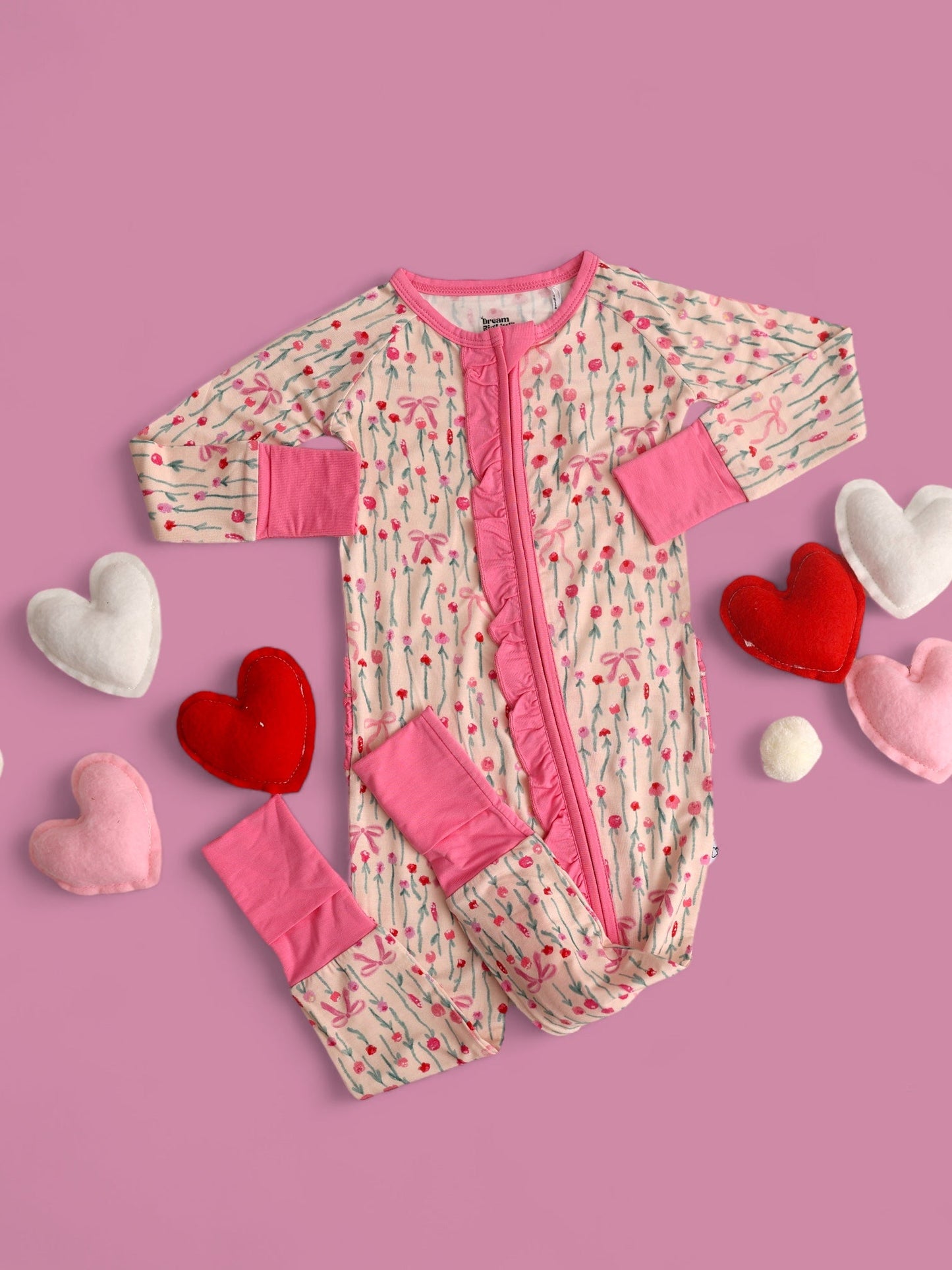 BLOOMS & BOWS DREAM FLORAL RUFFLE ZIPPER ROMPER