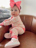 BLOOMS & BOWS DREAM FLORAL RUFFLE ZIPPER ROMPER