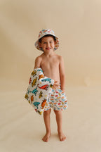 COLOR ME DINO DREAM SWIM TRUNKS