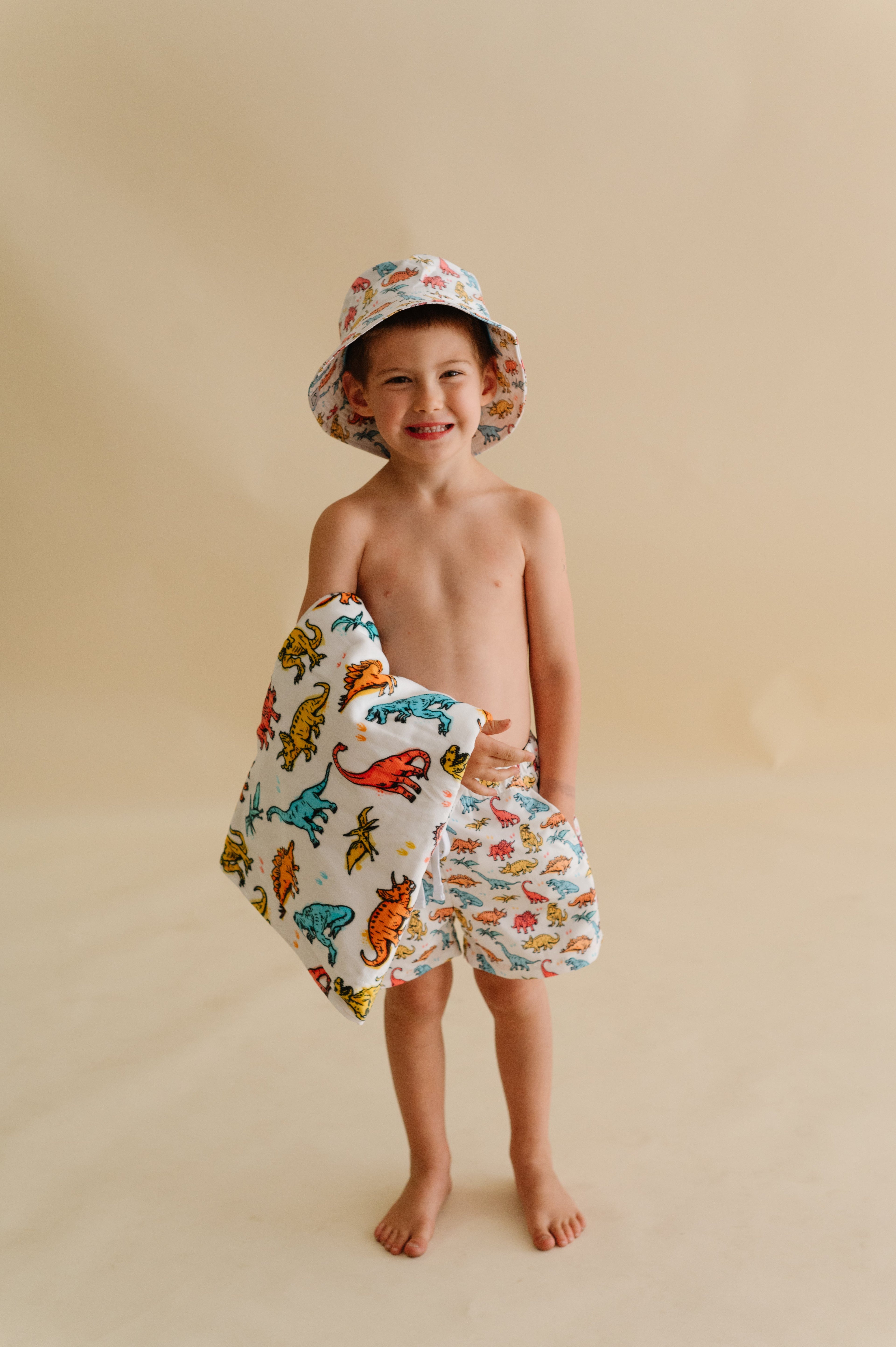 COLOR ME DINO DREAM SWIM TRUNKS