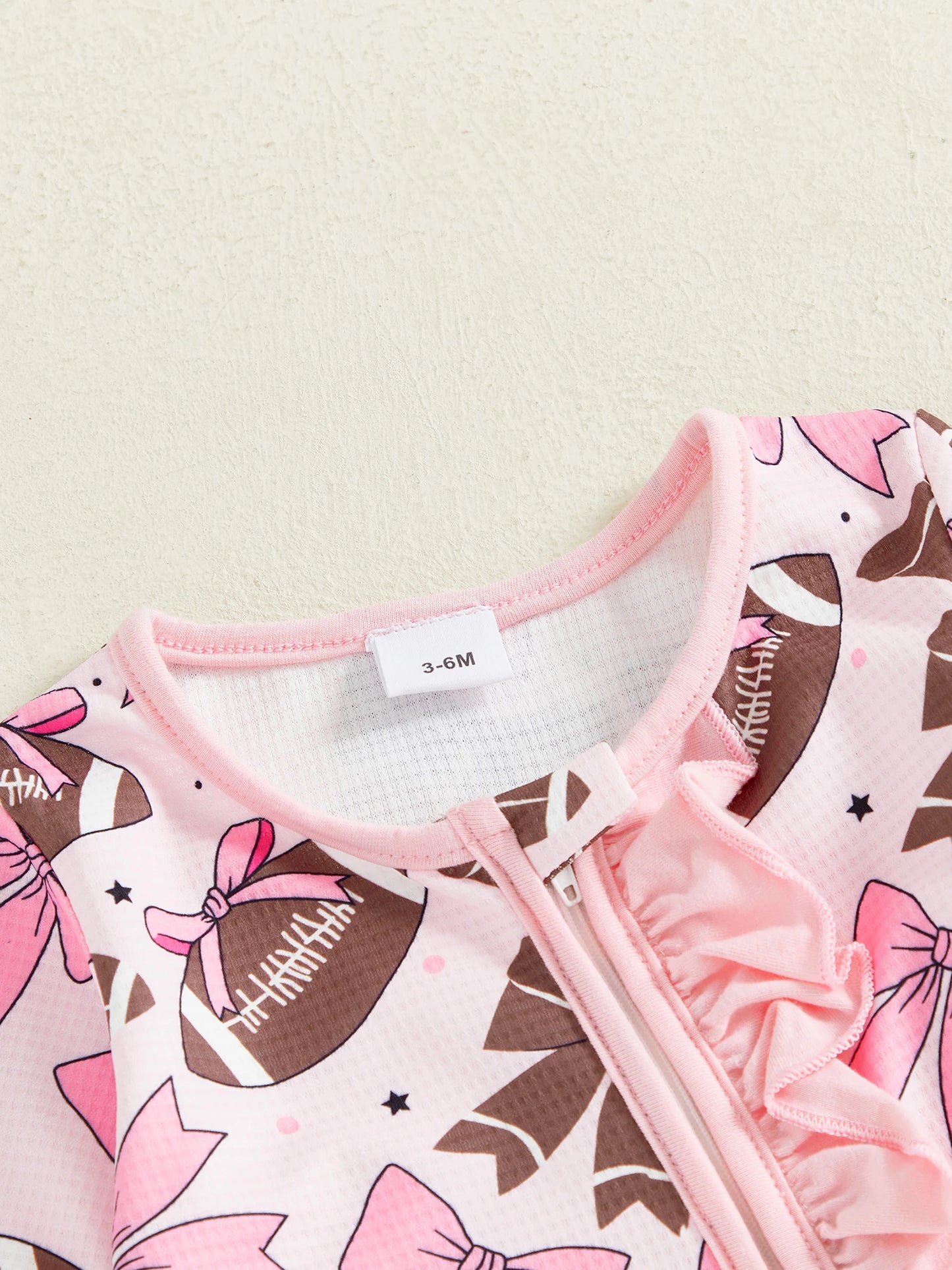 Baby Girl 2Pcs Footed Romper Fashionable Bow and Football Print Ruffled Long Sleeve Jumpsuit with Headband Set