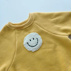 Fuzzy Smile Bodysuit Romper