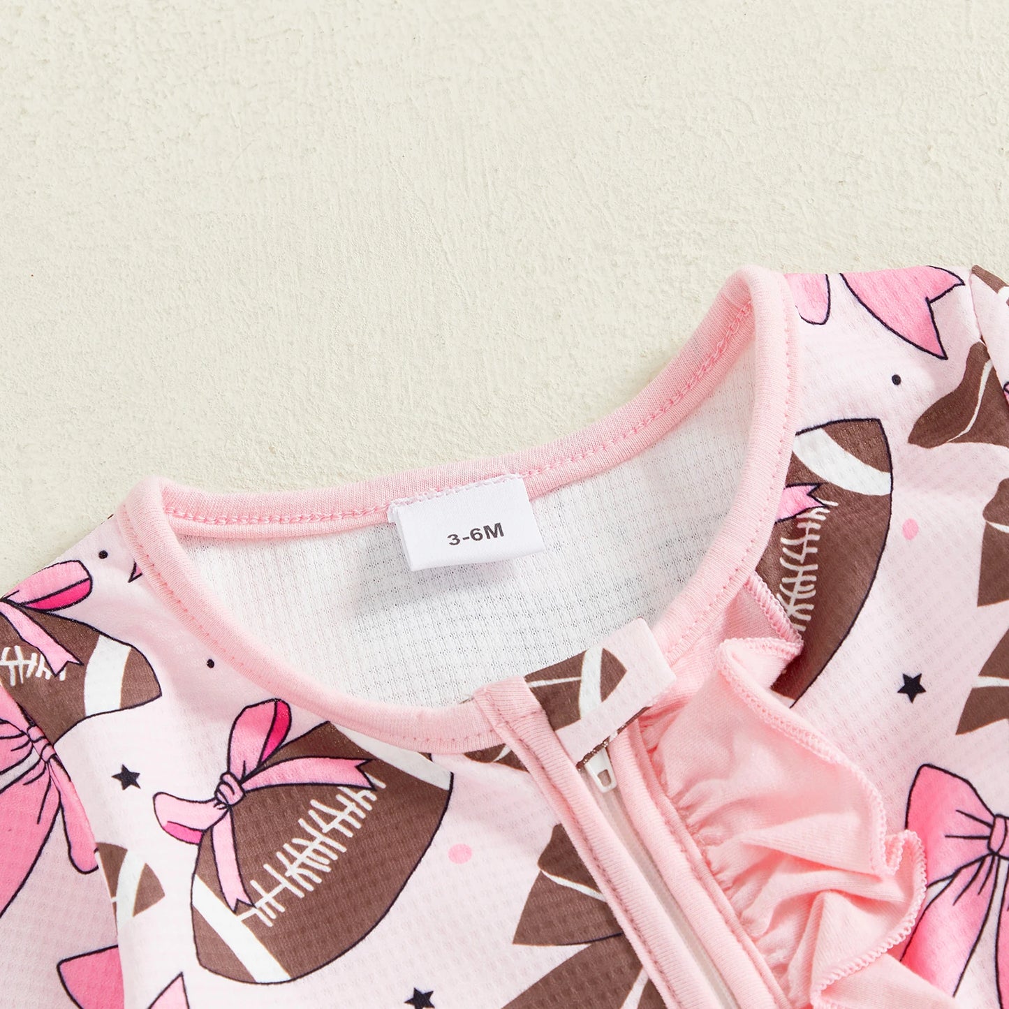 Baby Girl 2Pcs Footed Romper Fashionable Bow and Football Print Ruffled Long Sleeve Jumpsuit with Headband Set