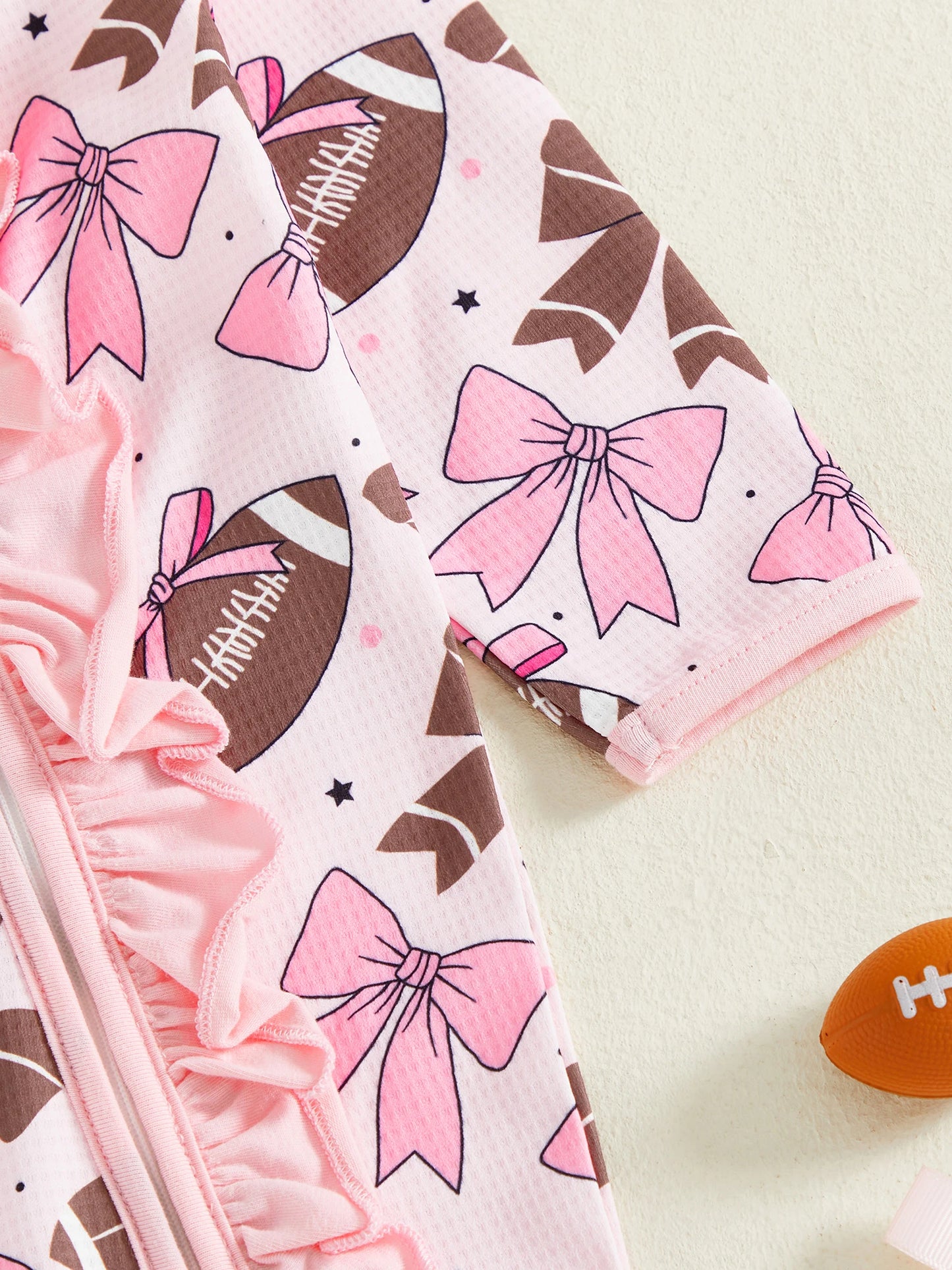 Baby Girl 2Pcs Footed Romper Fashionable Bow and Football Print Ruffled Long Sleeve Jumpsuit with Headband Set