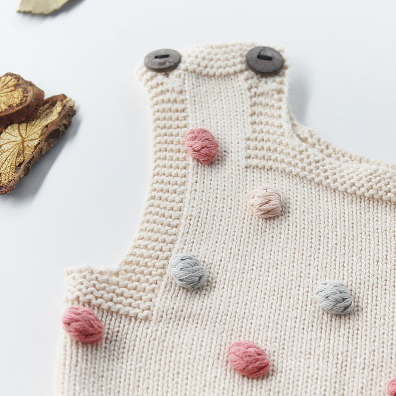 Knitted Baby Girl Romper with Colorful Pom Poms